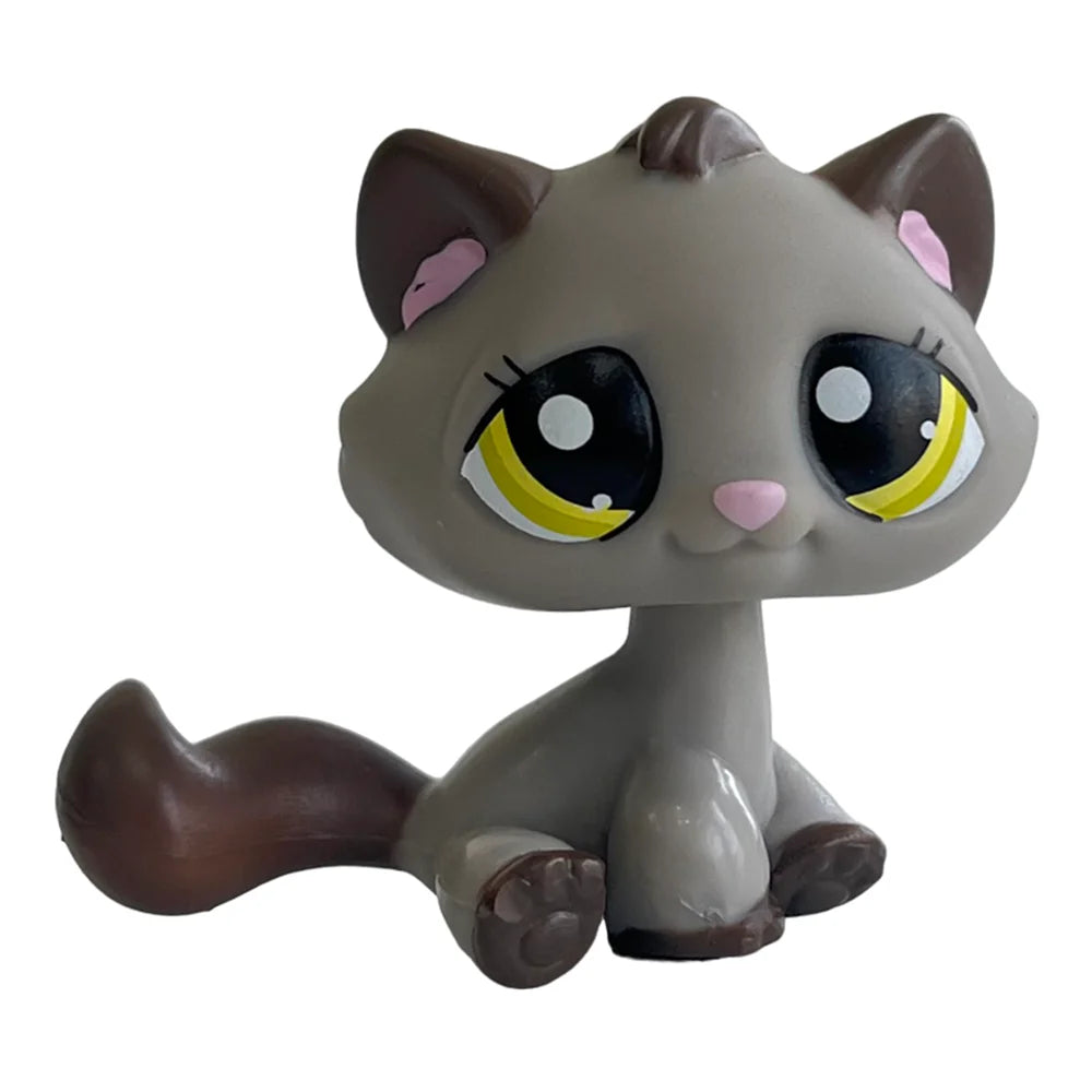 A charming bobble head pet figurine of a gray cat with large yellow eyes and brown fur.