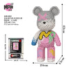 A pink bear figure made of micro building blocks, packaged with instructions and accessories.