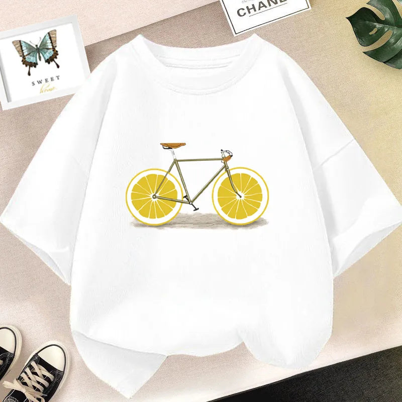 White graphic t-shirt featuring a yellow bicycle with lemon wheels on a light background