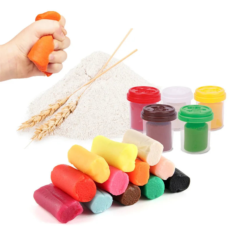 A collection of colorful dough and clay in various shades, including orange, pink, yellow, green, and red, next to a hand hol