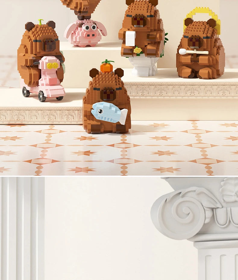 A set of cute capybara micro building blocks in various earthy and pastel colors displayed on a shelf.