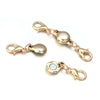 Gold-toned magnetic clasps for jewelry making featuring smooth, rounded metal connectors.