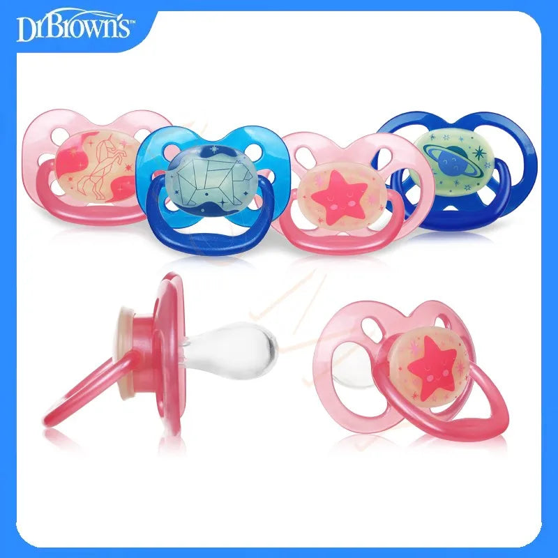 A set of soft silicone baby pacifiers or soothers in pink and blue colors.
