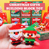 A hand holds two Christmas building block toys depicting Santa and a reindeer.