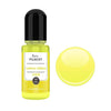 A glass bottle of Lemon Yellow resin pigment with a black cap next to a round yellow pigment disk.