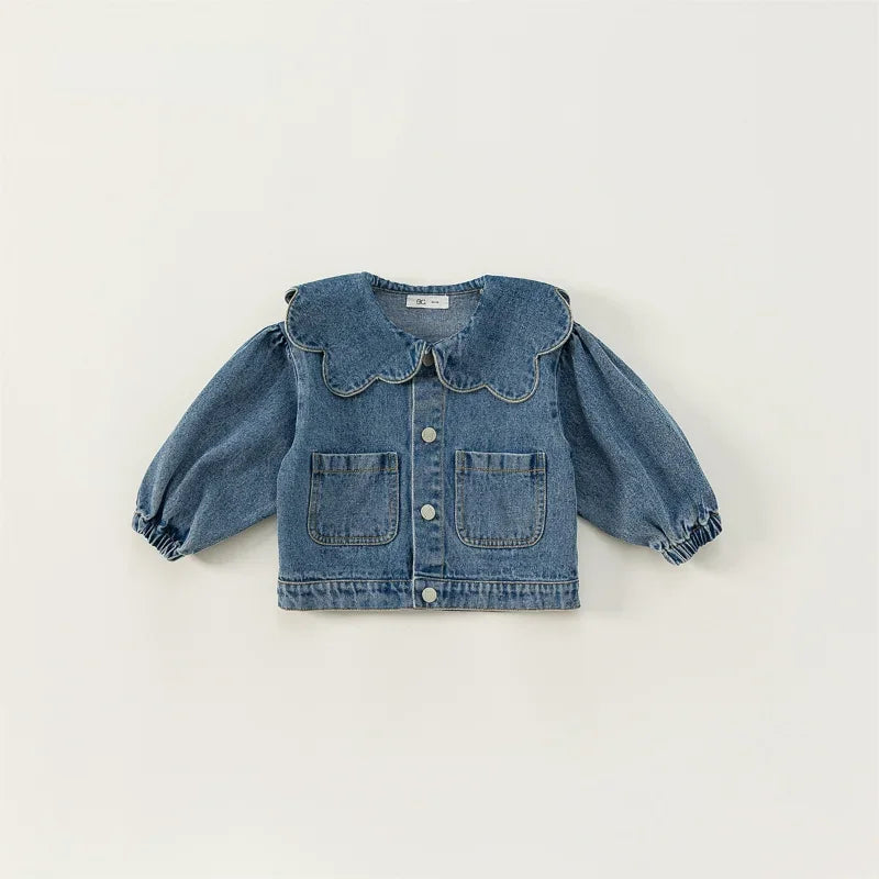 A blue denim jacket for kids featuring a ruffled collar and chest pockets.