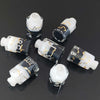 A collection of seven floral resin potion bottles shaped like polyhedral dice, featuring numbers 1 through 10.