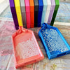 A large diamond painting tray with a pop-up plug for bead sorting is shown next to a colorful set of storage boxes.