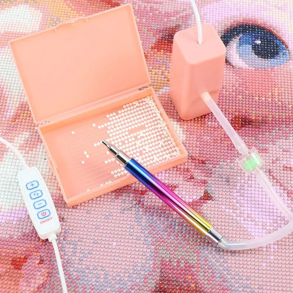 An electric diamond painting pen kit with a pink tool and a white suction tool displayed on a textured background.