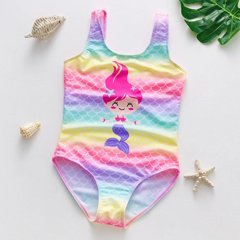A colorful one-piece swimsuit featuring a mermaid and unicorn design for a child.