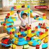 A boy is playing with a DIY magnetic track car set featuring yellow and blue tracks, trains, and building components.