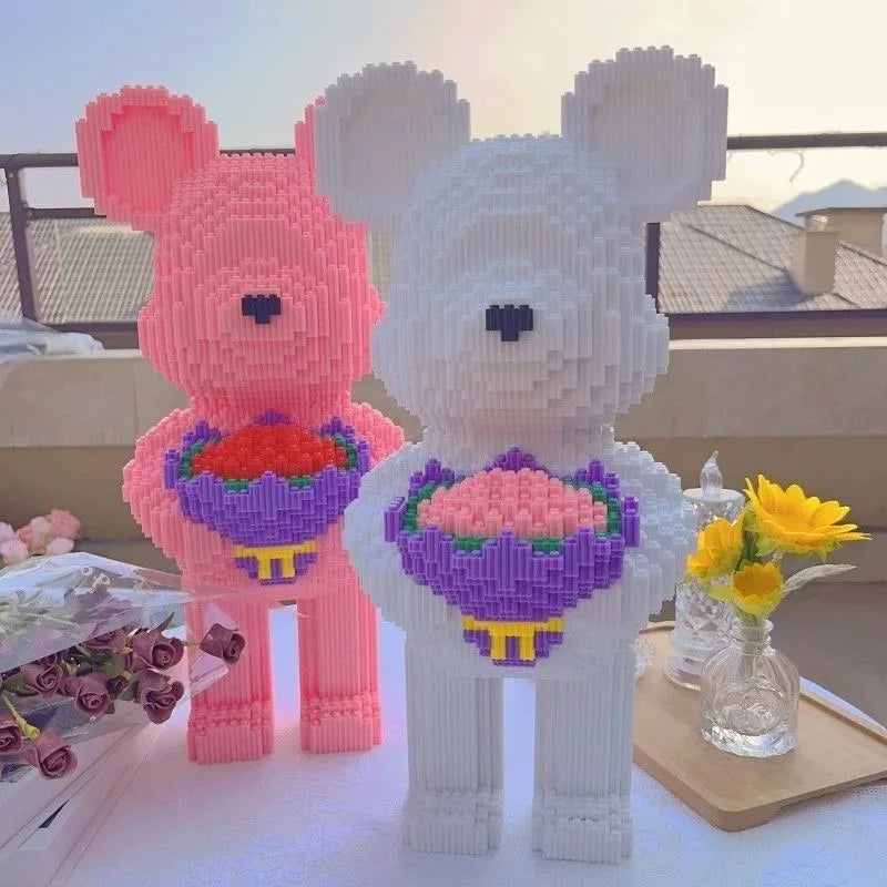 A pink and white flower bear constructed from building blocks and micro bricks.