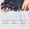 A hand is holding a black, twisted fabric, demonstrating its smooth texture and durability while water flows over it.