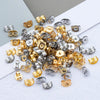 A collection of various stainless steel and gold-toned earring stud bases and backs for DIY jewelry making.