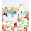 Hands demonstrate the correct way to play a jigsaw puzzle by avoiding dislocation and horizontal pulling.