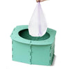 A teal foldable baby potty training seat with a lavender cloth cover is shown.