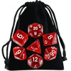 A black drawstring bag filled with a set of transparent polyhedral dice, including d6, d8, d10, and d20.