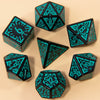 A set of seven fantasy carved polyhedral dice in teal and black colors arranged on a light background.