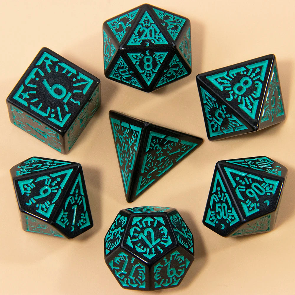 A set of seven fantasy carved polyhedral dice in teal and black colors arranged on a light background.
