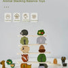 A wooden animal stacking balance toy featuring various forest animals like a hedgehog, bear, and squirrel.