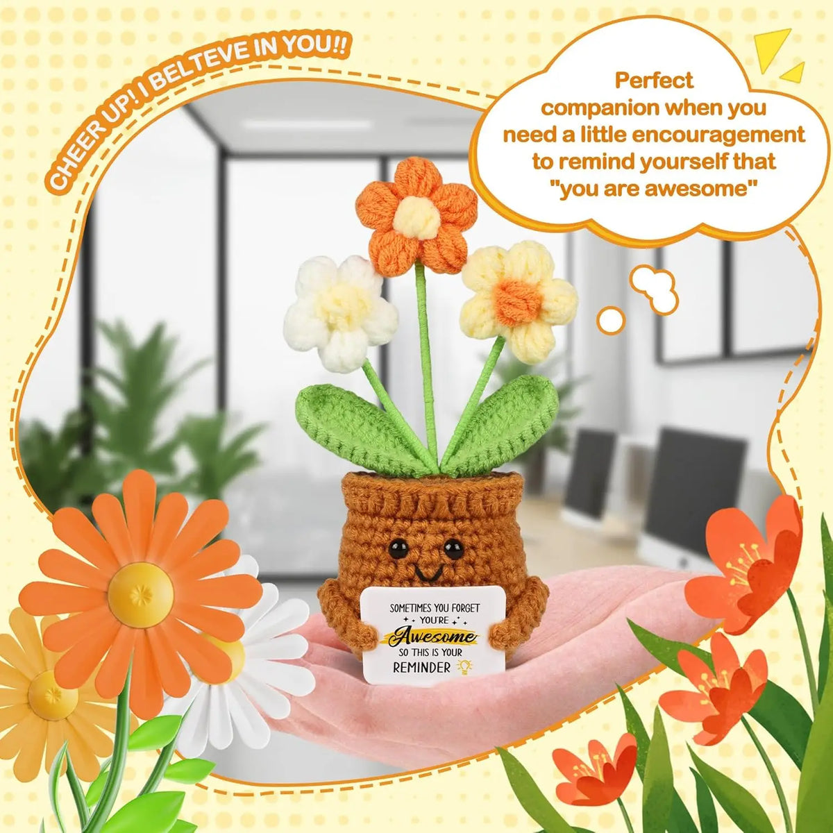Handmade crochet doll with orange and yellow flower accents sitting in a pot on a pink fabric.