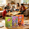 A set of Virus card game components including Evolution and Halloween expansions displayed on a wooden table.