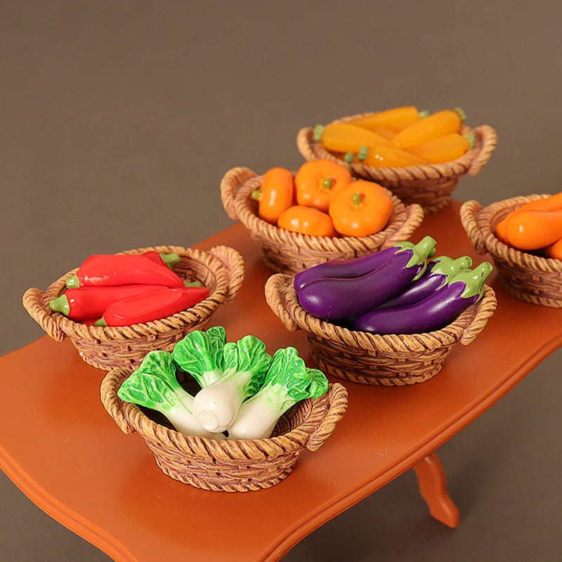 A miniature dollhouse vegetable basket play set filled with various colorful vegetables like carrots, peppers, and greens.