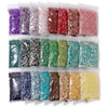 A collection of colorful natural tumbled stone chips in various shades and textures packaged in clear plastic bags.