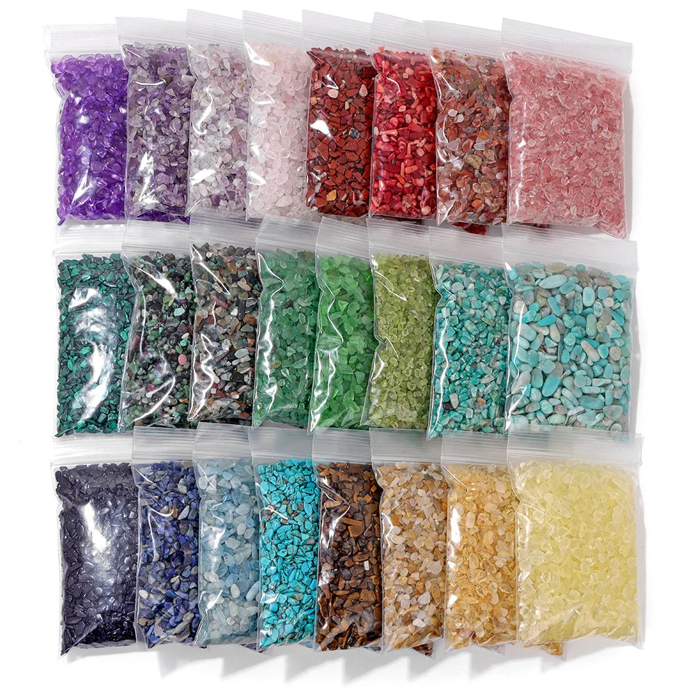 A collection of colorful natural tumbled stone chips in various shades and textures packaged in clear plastic bags.