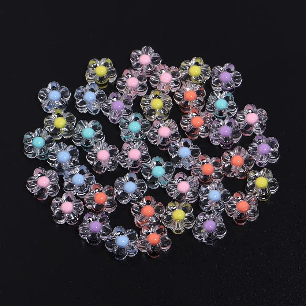 A cluster of colorful transparent acrylic flower beads in shades of pink, purple, yellow, and blue.