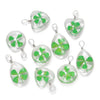 A set of handmade glass four leaf clover pendants with silver jump rings.
