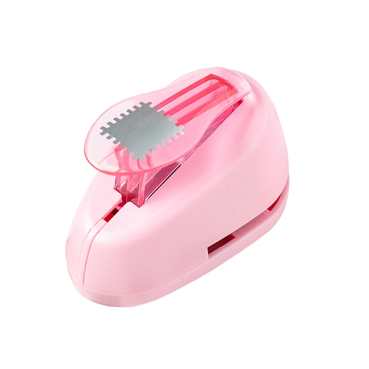 A pink lever action embosser tool used for scrapbooking and card making.