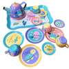 A colorful metal pretend play tea set featuring a purple teapot, cups, and plates with sea creature designs.