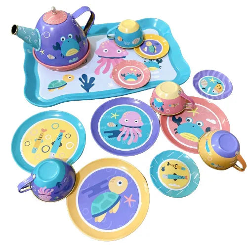 A colorful metal pretend play tea set featuring a purple teapot, cups, and plates with sea creature designs.