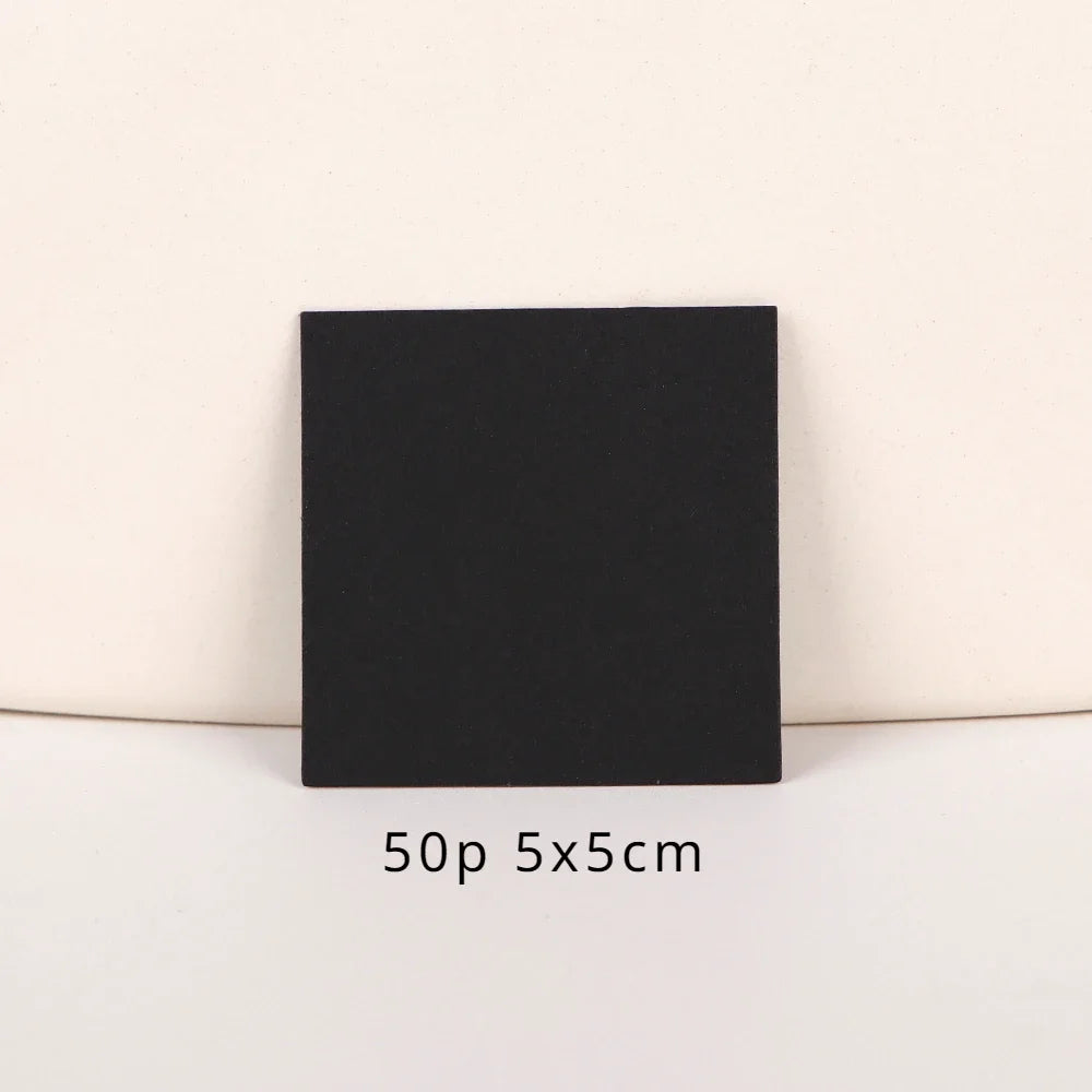 A black square jewelry display card is shown against a light background.
