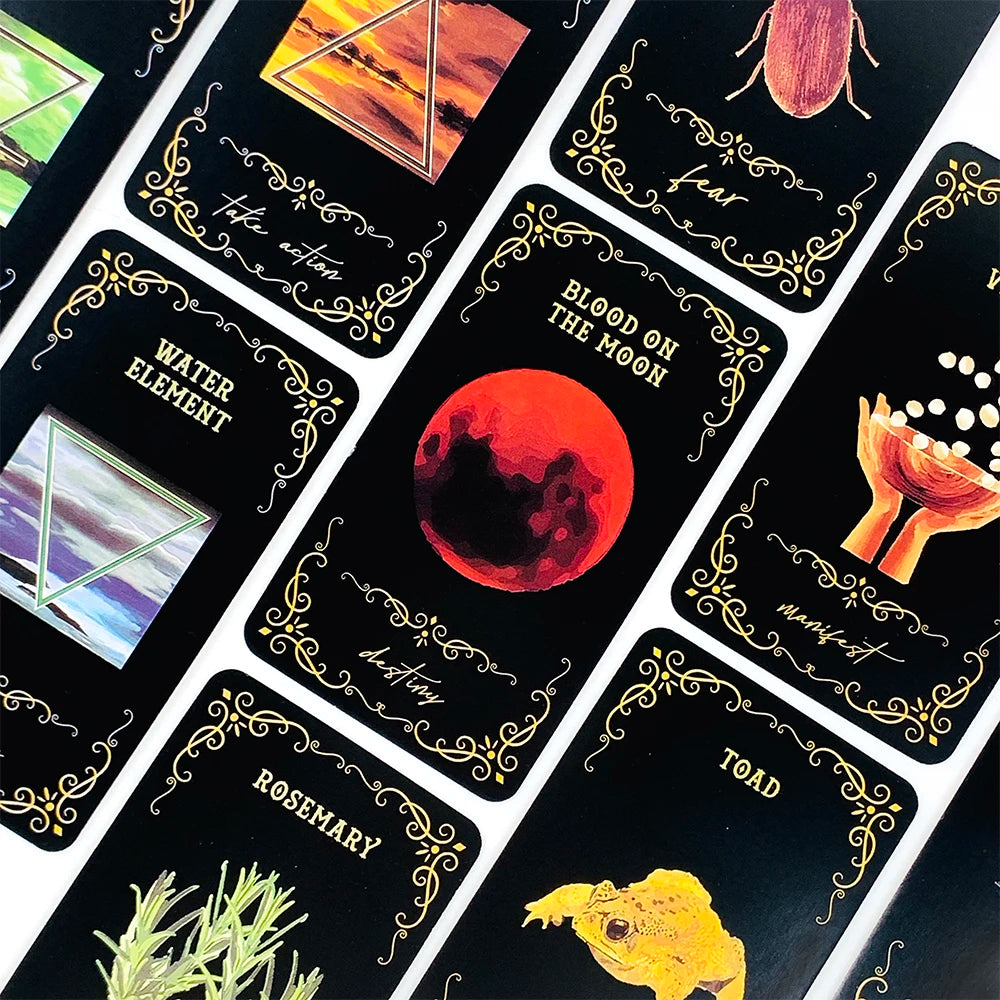 A close-up of a deck of oracle cards featuring various elements like Water, Fire, Earth, Air, and concepts such as Moon, Bloo
