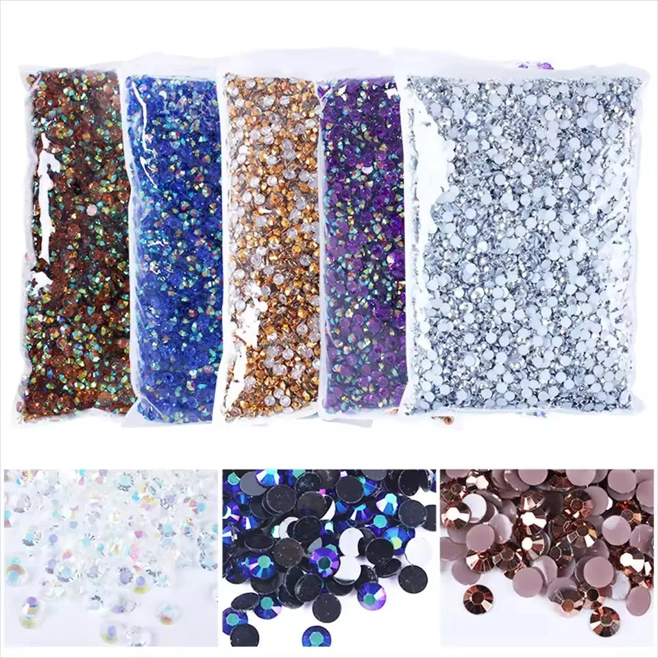 A collection of flat back resin rhinestones in various colors including gold, blue, purple, and silver.