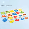 A wooden shape and color sorting puzzle board with various geometric shapes like squares, triangles, hexagons, and circles.