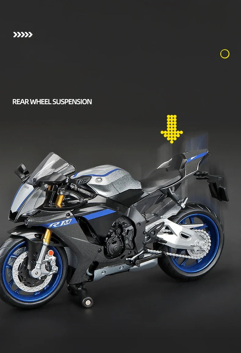 A silver and blue diecast model of a motorcycle showing the rear wheel suspension system.