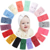 A collection of colorful nylon knit bow headbands for baby girls displayed in a circular arrangement.