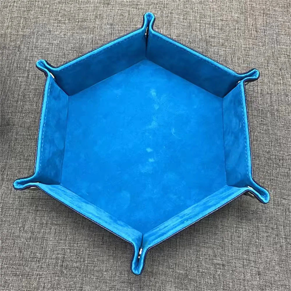 A bright blue foldable PU leather hexagonal dice tray used as a tabletop game organizer.