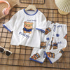 White long sleeve cotton pajama set for kids featuring a funny bear print and matching pants.
