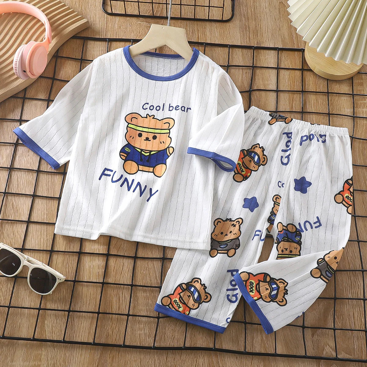White long sleeve cotton pajama set for kids featuring a funny bear print and matching pants.