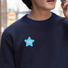 A dark blue sweatshirt with a light blue star design sticker on the chest.