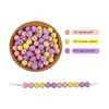 A collection of silicone round beads in various shades of pink, yellow, and purple for jewelry making