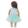 A doll wearing a light blue and iridescent unicorn-themed skirt outfit.