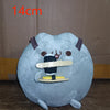 A light blue plush cat doll with black markings and pointed ears.