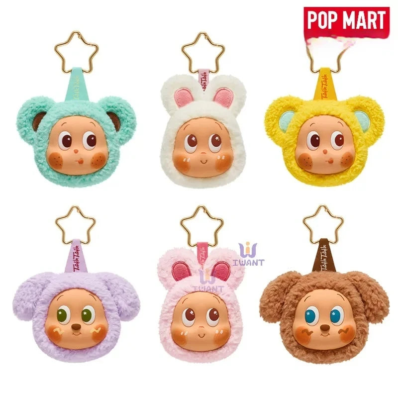 A collection of Pop Mart earbud case covers featuring various animal faces and colors.