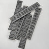 A collection of gray replacement keyboard contact strips for Yamaha digital pianos, laid out on a white surface.
