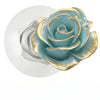 Moule à bougie en silicone en forme de rose bleu-vert avec accents dorés.